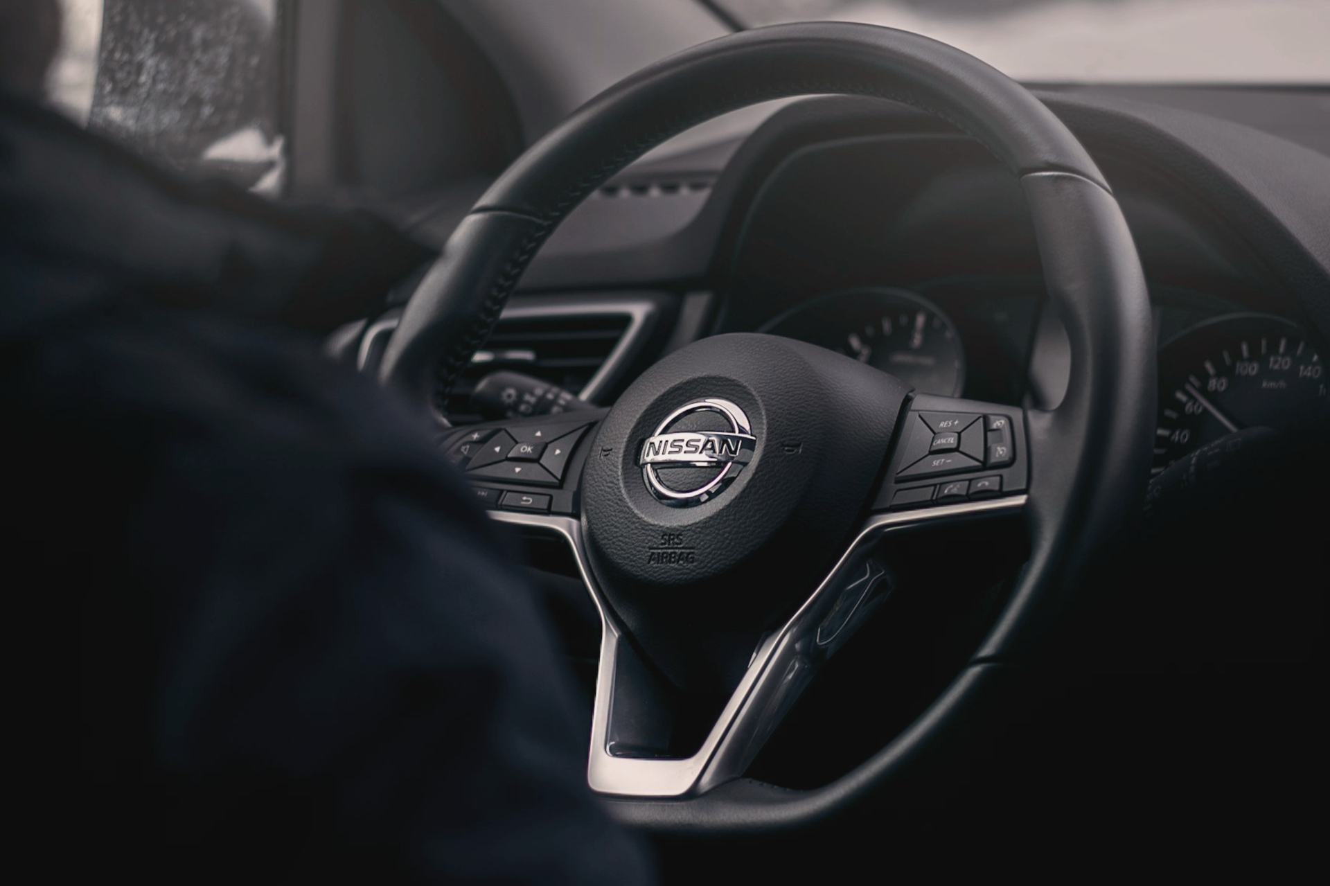 black Nissan steering wheel
